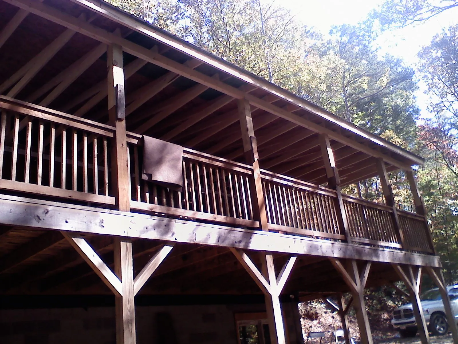 Timber framing under a new elevated porch and deck — Roof Leak Repair in Accord by Roofing Brothers